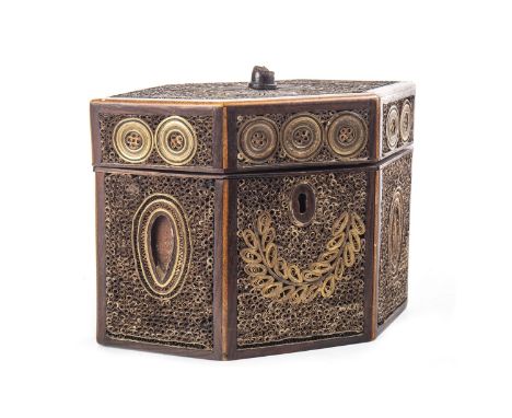 GEORGE III MAHOGANY ROLLED PAPER HEXAGONAL TEA CADDY, each panel decorated with geometric patterns, the hinged cover opening 