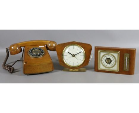 A wooden push button telephone by Steepletone along with a Kubler electric mantel clock and an oak cased barometer.