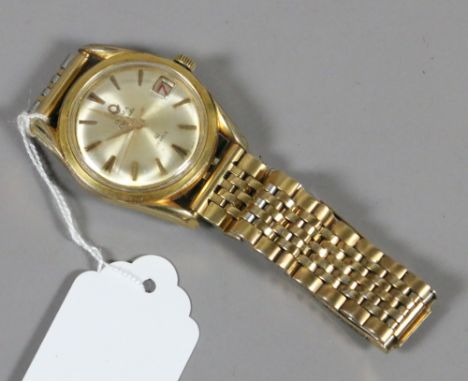 A gentleman's gold capped Olma Caravelle forty one jewels wristwatch with baton markers and date chapter.