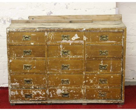 A pine painted fifteen drawer tool cabinet and contents.