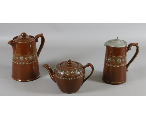 A three piece ceramic teaset with enamel decoration in the Greek Border design by Gibson Bros. England.