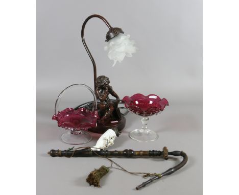 A German made smoking pipe, figural tablelamp and two ruby glass bowls.