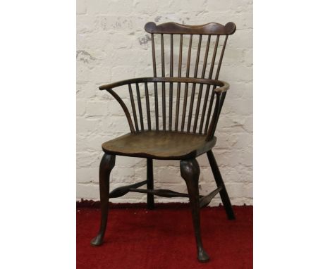 A comb back Windsor armchair.