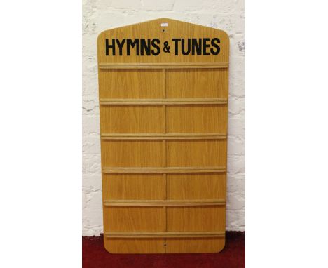 A light oak church hymn number board.