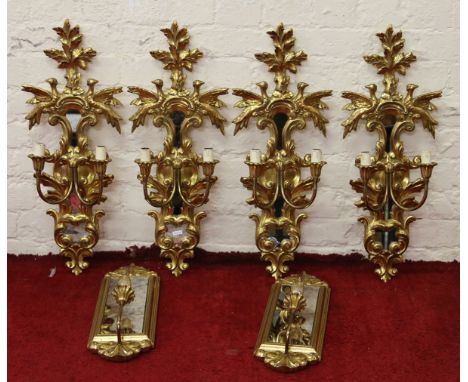Four twin branch gilt and mirrored wall light fittings along with a pair of single branch fittings.
