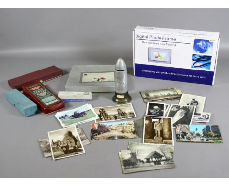 A First World War trench art shell in the form of a money box along with a collection of boxed cutlery, digital photo frame a