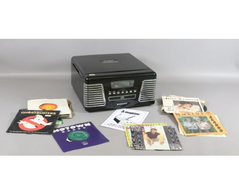 A Steepletone Authentic Reproduction record player and CD along with a small collection of records and remote control.