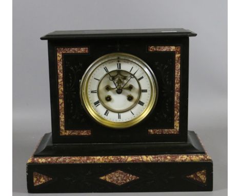 A Victorian slate and marble mantel clock with brass and enamel dial chiming on a gong complete with key.