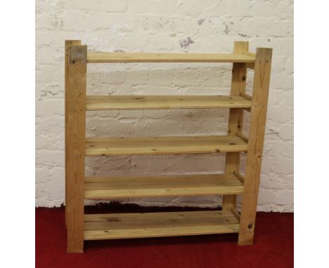 A pine five shelf garage storage rack.