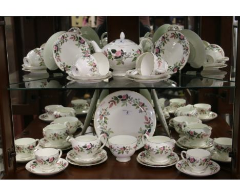 A Wedgwood six place tea service including two milk jugs, one teapot, one sugar bowl, one cake plate and six trios (approxima