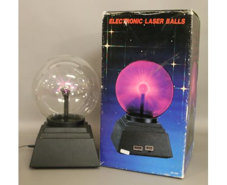 A boxed electronic laser touch lamp.