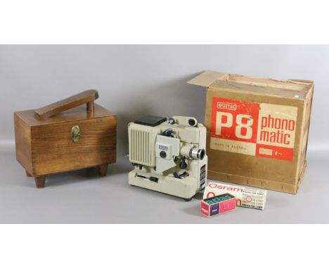 A boxed Eumig P8 projector along with a mahogany shoeshine case and contents.