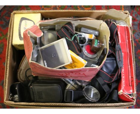 A box of photographic equipment to include camera bodies, lenses, flash guns, filters, etc.