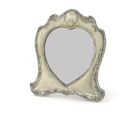 Silver heart shaped framed mirror, the surround with entwined foliate decoration, bevelled mirror plate and easel back, regis