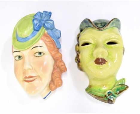 Karlstruhe Art Deco wall mask of a lady, 6" high; together with another ceramic wall mask of a lady wearing a hat with a bow,