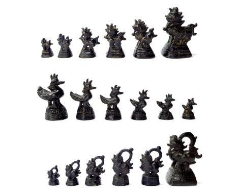 Collection of Asian bronze weights in three different graduated designs, the tallest 2.75" high (18)