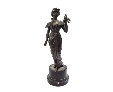 Bronze figure modelled as a lady with bird on her hand, mounted upon circular marble plinth, 9.5" high 