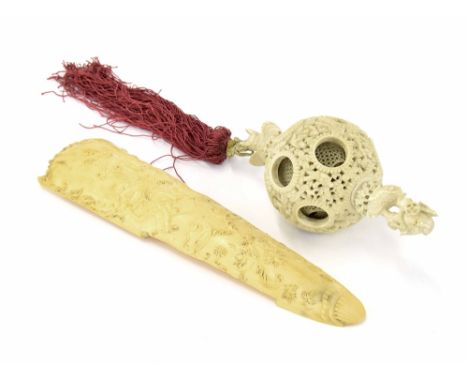 Chinese Canton carved ivory concentric ball, with a figural finial over a bat, later applied tassel, 19th century, 5.75" (fin