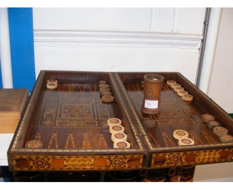 A backgammon board in parquetry box (also features chess/chequers layout on the reverse) CONDITION REPORTWe have attached a n