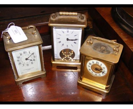 A brass cased carriage clock together with two others