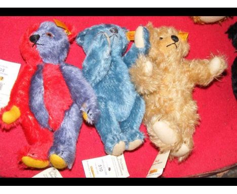 Three small collectable Steiff teddy bears with buttons and labels, the largest 20cms