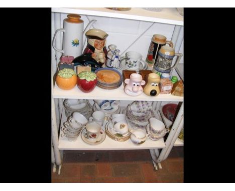 A pair of Sylvac preserve jars, together with promotional Wallace &amp; Gromit egg cups and assorted teasets, etc. - on two s