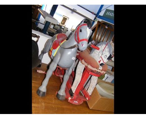 A vintage children's Mobo ride-on metal horse, together with a wooden rocking horse 