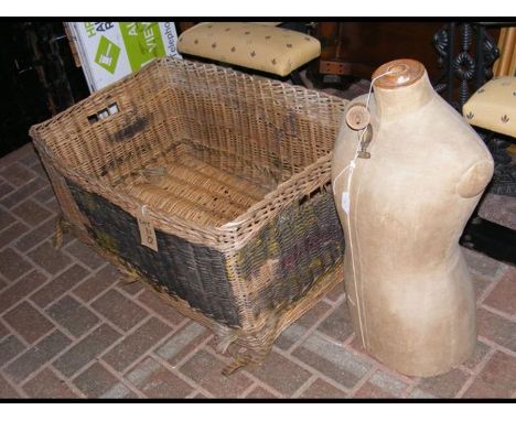 An old dressmaker's dummy, together with a vintage laundry basket 