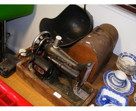 A vintage Singer sewing machine, together with a coal scuttle 