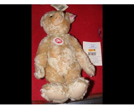 A collectable Steiff teddy bear with button to ear and label - 27cms