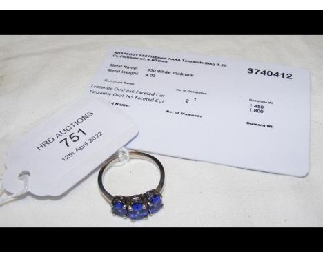 A three stone tanzanite ring in platinum setting, having certificate 