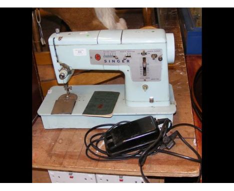 A Model 348 Singer Sewing Machine in powder blue 