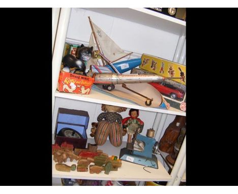 A quantity of vintage toys, including Tri-ang Minic 'Kitty and Butterfly', a Pelham Puppet and racehorse spinner - on two she