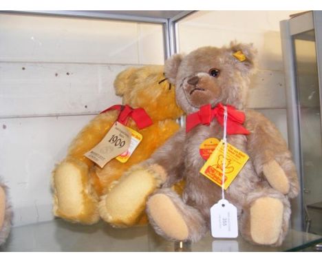 A modern Steiff 1909 replica bear with button to ear and growler together with one other