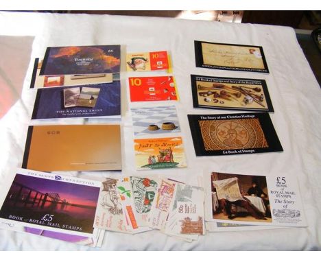 A collection of 27 post office stamp booklets