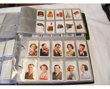 Two albums bearing vintage military and shipping cigarette cards