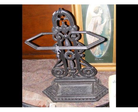 A cast metal umbrella/stick stand