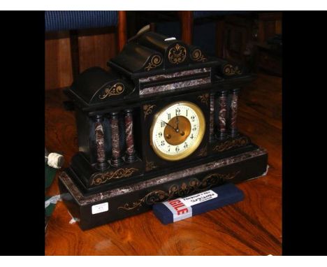 A slate and marble Victorian chiming mantel clock - 52cms wide