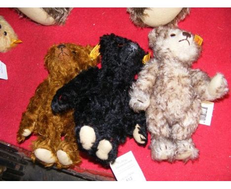 Three collectable Steiff teddy bears with buttons to ears and some with labels, the largest 20cms