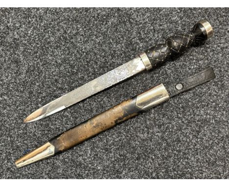 Scottish Dirk with double edged etched blade decorated with Thistles, 285mm in length. No makers mark. Decorated wooden grip.