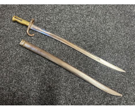 French Chassepot M1866 Pattern Bayonet with single edged fullered balde 570mm in length, spine of blade dated 1868. Cast bras