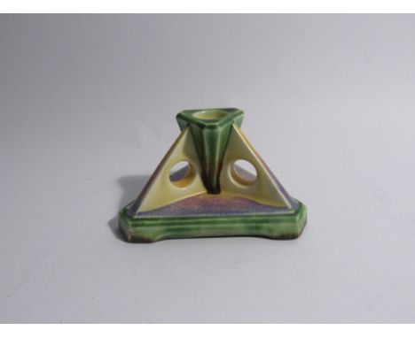 A Bretby Art Deco ceramic candlestick of triangular form, 14cm long 