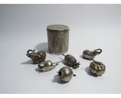 A Kashmiri or Indian silver drum shaped box with lid together with six Cambodian small silver boxes including two elephants a