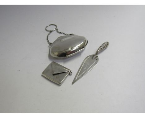 A silver purse, silver trowel form book mark and Gourdel Vales &amp; Co silver envelope form stamp case (3) 35g 