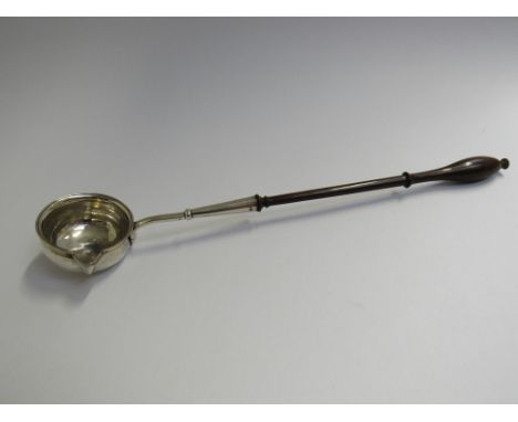 A Georgian tody ladle with turned treen handle, London 1813 (slight crack to handle), 35cm long 