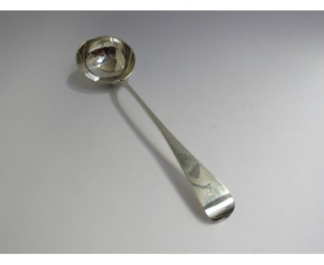 A Victorian Charles Boyton (11) silver ladle with crested handle, London 1884, 36cm long, 268g