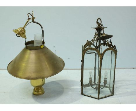 A brass hanging three light lantern, with bevelled glass panels, together with a modern style brass hanging lantern. (2)