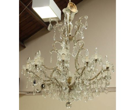 A Bohemian very large cut glass fifteen light chandelier, with scrolled glass mounted gilt metal frame, set with prism and lo