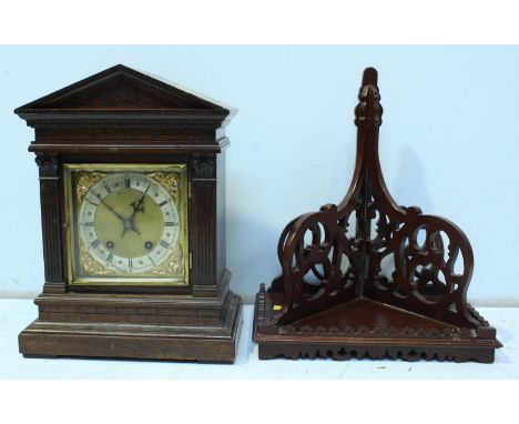 A Victorian oak architectural bracket clock, the square gilt dial with silvered chapter ring and supported on a stepped base,
