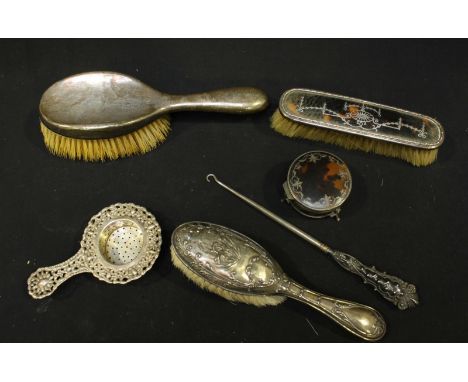 A collection of silver items including a silver and tortoiseshell box and cover, and matching clothes brush, together with tw